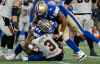 Winnipeg Blue Bombers' Devin Adams (94) and TyJuan Garbutt (9) pile on B.C. Lions quarterback Vernon Adams Jr. (3) as he is sacked by Bombers' Adam Bighill (hidden) during second half CFL action in Winnipeg Thursday, August 1, 2024.    THE CANADIAN PRESS/John Woods