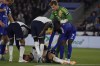 Tottenham's Rodrigo Bentancur lies injured on the pitch during the English Premier League soccer match between Leicester and Tottenham Hotspur at King Power Stadium in Leicester, England, Monday, Aug. 19, 2024.(AP Photo/Rui Vieira)