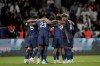 PSG players celebrate after Lee Kang-in scored their sixth goal during the French League 1 soccer match between Paris Saint-Germain and Montpellier at the Parc des Princes in Paris, Friday, Aug. 23, 2024. (AP Photo/Thibault Camus)