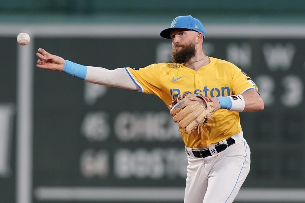Boston Red Sox shortstop Trevor Story throws to first base on the ground out by Chicago White Sox's Nicky Lopez during the first inning of a baseball game, Saturday, Sept. 7, 2024, in Boston. (AP Photo/Michael Dwyer)