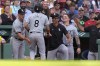 Chicago White Sox's Nicky Lopez (8) is welcomed to the dugout after scoring on a single by Jacob Amaya in the ninth inning of a baseball game against the Boston Red Sox, Sunday, Sept. 8, 2024, in Boston. (AP Photo/Steven Senne)