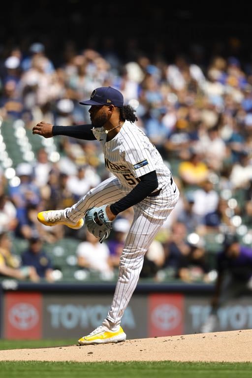 Milwaukee Brewers pitcher Freddy Peralta throws to the Colorado Rockies during the first inning of a baseball game Sunday, Sept. 8, 2024, in Milwaukee. (AP Photo/Jeffrey Phelps)