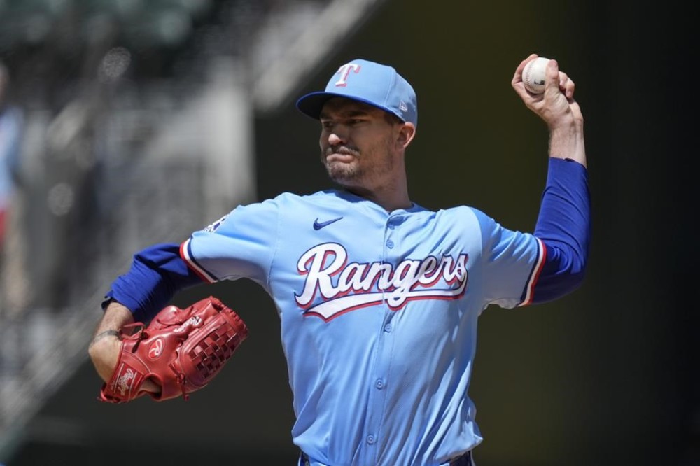 Texas Rangers starting pitcher Andrew Heaney throws during the first inning of a baseball game against the Los Angeles Angels, Sunday, Sept. 8, 2024, in Arlington, Texas. (AP Photo/LM Otero)