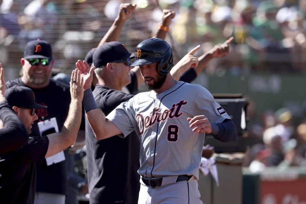 Detroit Tigers' Matt Vierling (8) celebrates after scoring on an RBI single by Riley Greene during the eighth inning of a baseball game against the Oakland Athletics in Oakland, Calif., Sunday, Sept. 8, 2024. (AP Photo/Jed Jacobsohn)