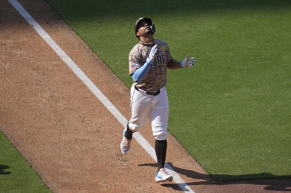 San Diego Padres' Xander Bogaerts celebrates after hitting a two-run home run during the eighth inning of a baseball game against the San Francisco Giants, Sunday, Sept. 8, 2024, in San Diego. (AP Photo/Gregory Bull)