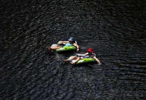 People float in the Madawaska River in Renfrew County, Ont., on July 8, 2024. The Weather Network predicts that Canadians will see a slow transition into autumn as temperatures in most regions are expected to be above normal in the coming weeks. THE CANADIAN PRESS/Sean Kilpatrick