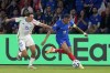 France's Kylian Mbappe runs with the ball, pursued by Italy's Andrea Cambiasso, during the UEFA Nations League soccer match between France and Italy at the Parc des Princes in Paris, Friday, Sept. 6, 2024. (AP Photo/Michel Euler)