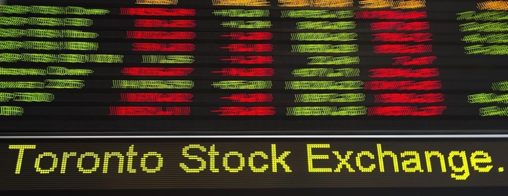 Financial numbers flow on the digital ticker tape at the TMX Group in Toronto's financial district on May 9, 2014. A newly released ranking of the Toronto Stock Exchange's top performers shows investors continue to be attracted to companies at the forefront of the energy transition. THE CANADIAN PRESS/Darren Calabrese