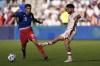 Canada midfielder Jonathan Osorio (21) kicks the ball away from United States forward Christian Pulisic (10) during the second half of an international friendly soccer game, Saturday, Sept. 7, 2024, in Kansas City, Mo. Canada won 2-1. (AP Photo/Charlie Riedel)