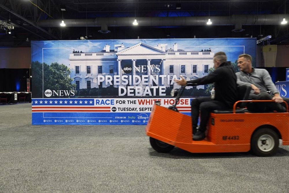 Signage at the media filing center ahead of the presidential debate between Republican presidential candidate former President Donald Trump and Democratic presidential nominee Vice President Kamala Harris, Monday, Sept. 9, 2024, in Philadelphia. (AP Photo/Pablo Martinez Monsivais)