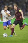 France's Matteo Guendouzi, left, tries to stop Belgium's Kevin De Bruyne during the UEFA Nations League soccer match between France and Belgium at the Groupama stadium in Decines, outside Lyon, France, Monday, Sept. 9, 2024. (AP Photo/Laurent Cipriani)