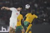 Indonesia's Thom Jan Haye, left, battles for the ball against Australia's Awer Mabil during the FIFA World Cup 2026 qualifier third round Group C Asia soccer match between Indonesia and Australia at Gelora Bung Karno stadium in Jakarta, Indonesia, Tuesday, Sept 10, 2024. (AP Photo/Achmad Ibrahim)