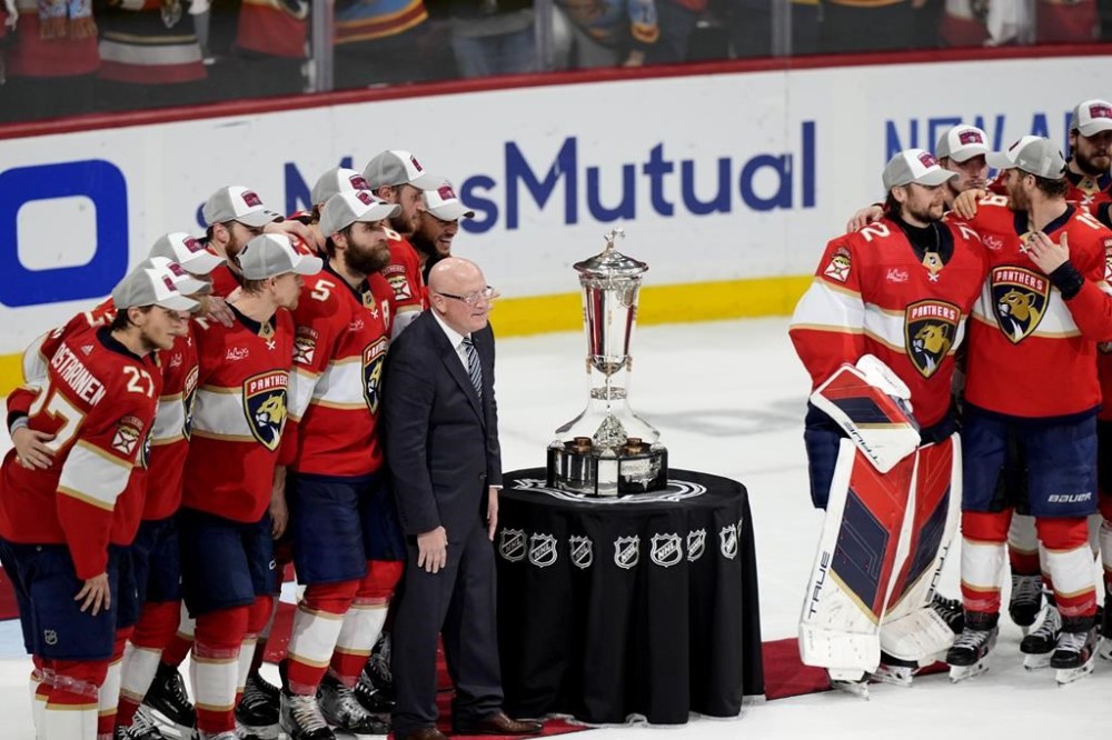 Bill Daly, deputy commissioner of the NHL, center left, poses with the Florida Panthers and the Prince of Wales Trophy after after the Panthers defeated the New York Rangers in Game 6 to win the Eastern Conference finals, Saturday, June 1, 2024, in Sunrise, Fla. THE CANADIAN PRESS/AP-Lynne Sladky