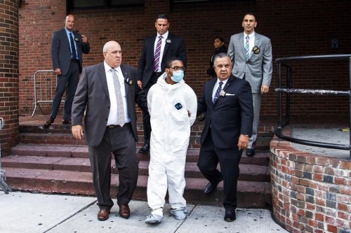 FILE - Tyrese Haspil is escorted out of the 7th precinct by NYPD detectives, July 17, 2020, in New York. (AP Photo/Eduardo Munoz Alvarez, File)