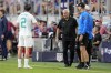 New Zealand head coach Darren Bazeley, center, speaks with Tim Payne (2) during the first half of a friendly soccer match against the United States, Tuesday, Sept. 10, 2024, in Cincinnati. (AP Photo/Jeff Dean)