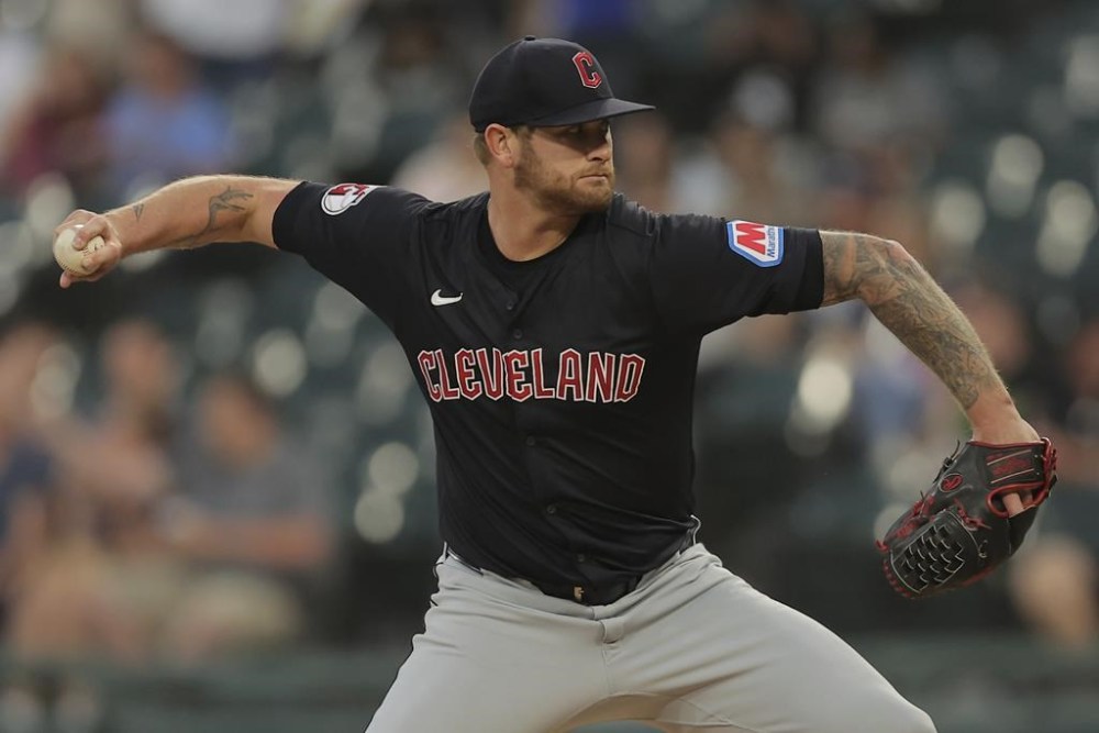 Cleveland Guardians starting pitcher Ben Lively throws during the first inning of a baseball game against the Chicago White Sox, Tuesday, Sept. 10, 2024, in Chicago. (AP Photo/Melissa Tamez)