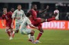 Canada forward Cyle Larin, right, reaches out to take control of a pass as Mexico defenseman Victor Guzman, center front, defends in the first half of an international friendly soccer match, Tuesday, Sept. 10, 2024, in Arlington, Texas. (AP Photo/Tony Gutierrez)