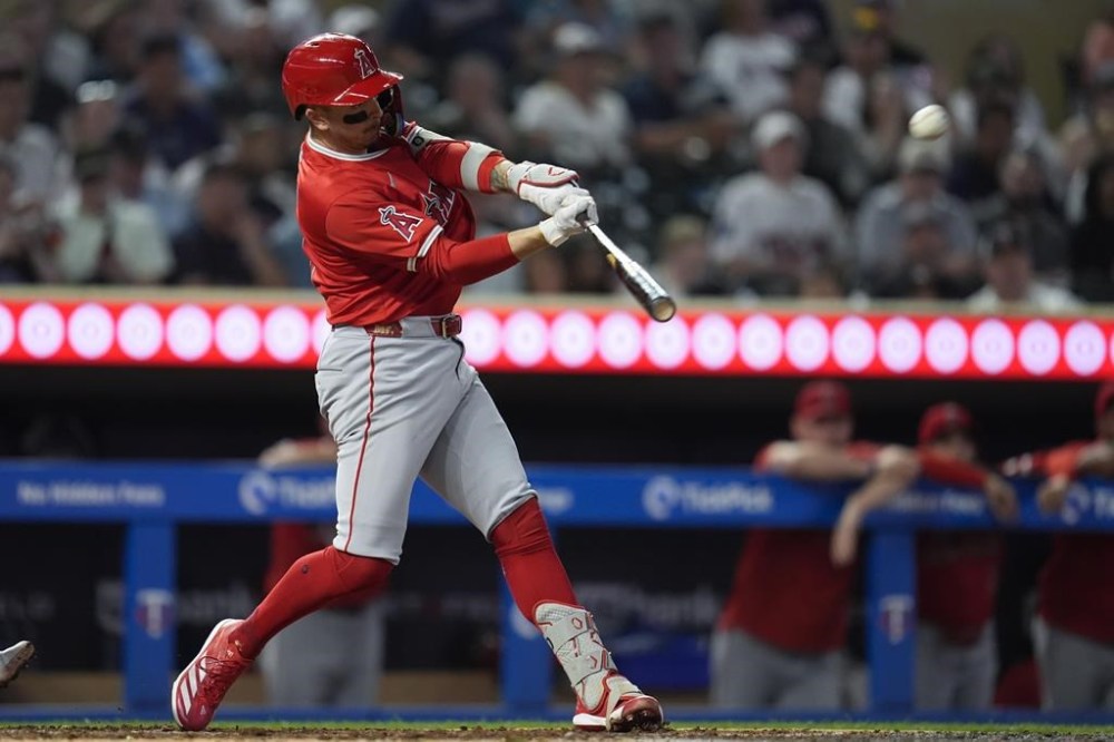 Los Angeles Angels' Zach Neto hits a 3-run home run during the fifth inning of a baseball game against the Minnesota Twins, Tuesday, Sept. 10, 2024, in Minneapolis. (AP Photo/Abbie Parr)