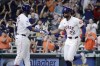 Houston Astro' Yordan Alvarez and pinch runner Jason Heyward (22) celebrate Heyward's score on the RBI single by Jose Altuve against the Oakland Athletics during the seventh inning of a baseball game, Tuesday, Sept. 10, 2024, in Houston. (AP Photo/Michael Wyke)