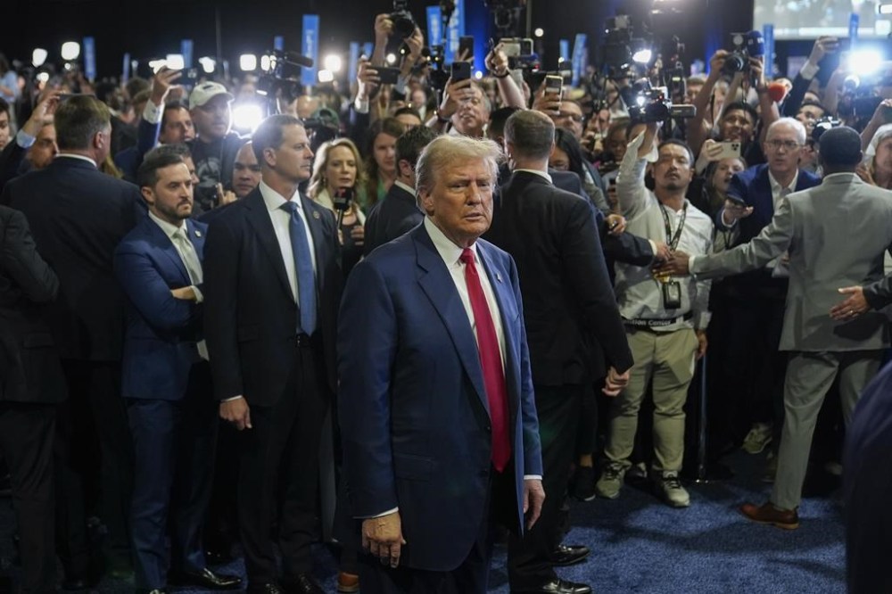 Republican presidential nominee former President Donald Trump arrives to begin speaking to reporters in the spin room after a presidential debate with Democratic presidential nominee Vice President Kamala Harris, Tuesday, Sept. 10, 2024, in Philadelphia. (AP Photo/Pablo Martinez Monsivais)