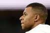 Real Madrid's Kylian Mbappe concentrates before the Spanish La Liga soccer match between Real Madrid and Betis at the Santiago Bernabeu stadium in Madrid, Spain, Sunday, Sept. 1, 2024. (AP Photo/Pablo Garcia)