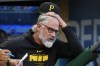 Pittsburgh Pirates manager Derek Shelton reacts in the dugout during the first inning of a baseball game against the Washington Nationals in Pittsburgh, Thursday, Sept. 5, 2024. (AP Photo/Gene J. Puskar)