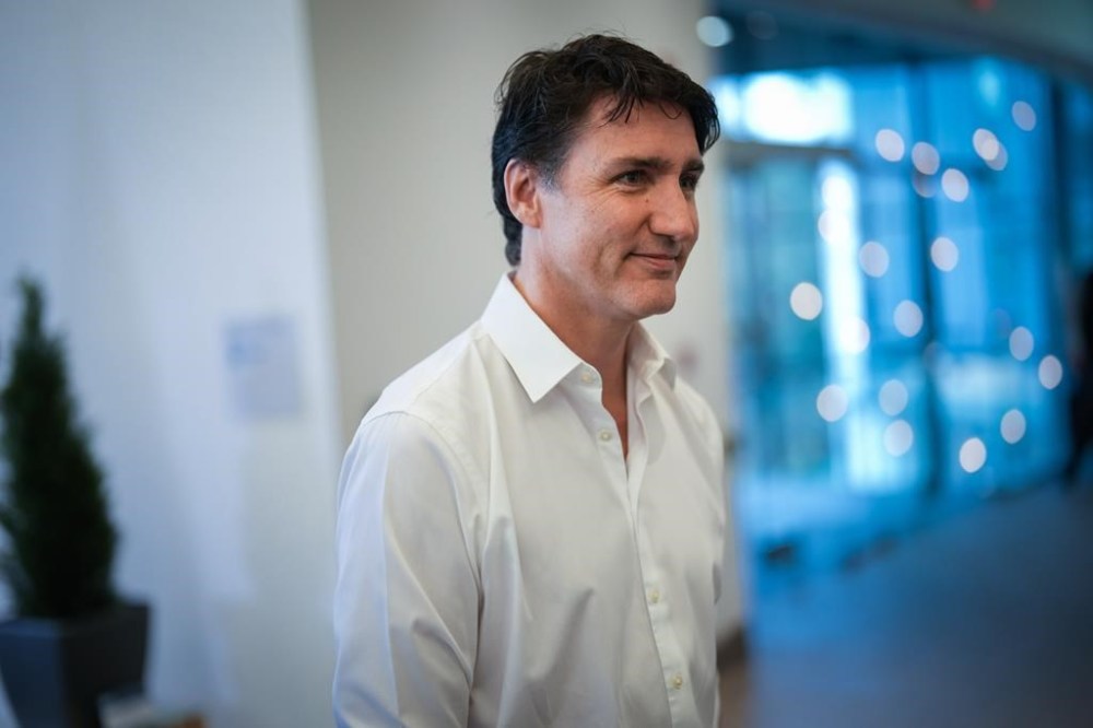 Prime Minister Justin Trudeau walks to a meeting room after speaking to reporters at the Liberal caucus retreat in Nanaimo, B.C., on Wednesday, September 11, 2024. THE CANADIAN PRESS/Darryl Dyck