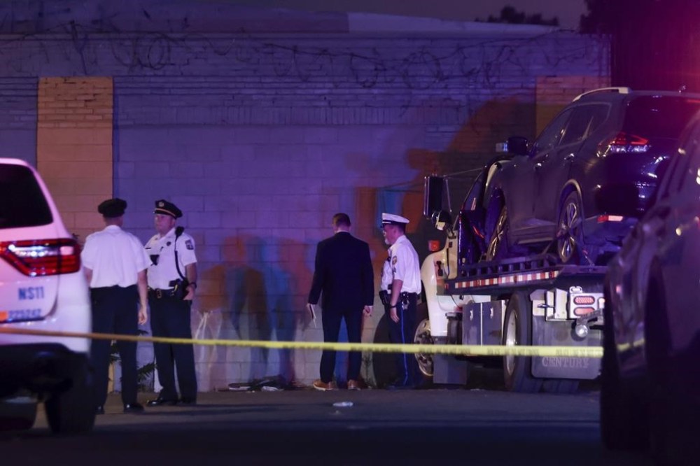 Law enforcement investigate the shooting of Philadelphia Police officer Jaime Ramos in Philadelphia on Saturday, June 22, 2024. (Elizabeth Robertson/The Philadelphia Inquirer via AP)