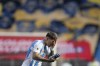 Argentina's Enzo Fernandez refreshes himself during a qualifying soccer match against Colombia for the FIFA World Cup 2026 at the Metropolitano Roberto Melendez stadium in Barranquilla, Colombia, Tuesday, Sept. 10, 2024. (AP Photo/Fernando Vergara)