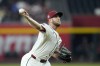 Arizona Diamondbacks pitcher Merrill Kelly throws against the Texas Rangers during the first inning of a baseball game Wednesday, Sept. 11, 2024, in Phoenix. (AP Photo/Ross D. Franklin)