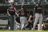 Cleveland Guardians manager Stephen Vogt, left, celebrates with Steven Kwan (38) at the dugout after scoring on a Lane Thomas 2 RBI single during the first inning of a baseball game against the Chicago White Sox in Chicago, Wednesday, Sept. 11, 2024. (AP Photo/Paul Beaty)