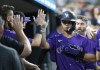 Colorado Rockies' Ezequiel Tovar celebrates after scoring against the Detroit Tigers during the fifth inning of a baseball game, Wednesday, Sept. 11, 2024, in Detroit. Tovar also drove in two runs in the fifth inning. (AP Photo/Duane Burleson)
