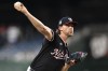 Washington Nationals starting pitcher Jake Irvin throws during the second inning of a baseball game against the Atlanta Braves, Wednesday, Sept. 11, 2024, in Washington. (AP Photo/John McDonnell)