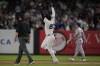 New York Yankees' Juan Soto, center, celebrates after hitting a two-run home run during the sixth inning of a baseball game against the Kansas City Royals at Yankee Stadium, Wednesday, Sept. 11, 2024, in New York. (AP Photo/Seth Wenig)