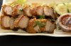 FILE - Crispy Pork Belly is presented at 