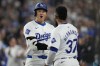 Los Angeles Dodgers designated hitter Shohei Ohtani (17) celebrates with Teoscar Hernández (37) after hitting a home run during the first inning of a baseball game against the Chicago Cubs in Los Angeles, Wednesday, Sept. 11, 2024. (AP Photo/Ashley Landis)