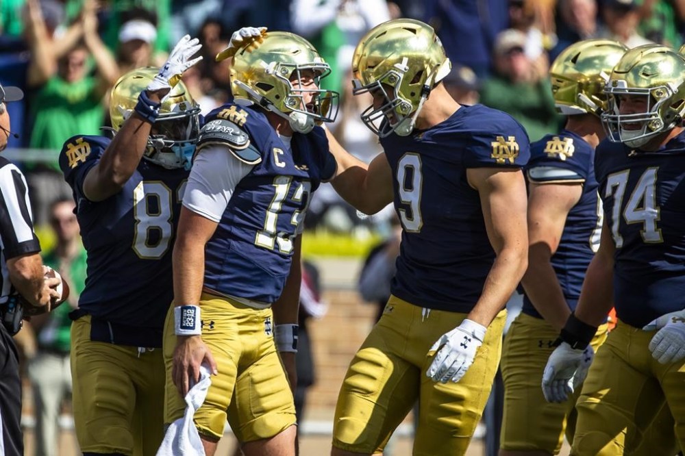 Notre Dame quarterback Riley Leonard (13) celebrates after scoring a touchdown with tight end Eli Raridon (9) during an NCAA college football game against Northern Illinois, Saturday, Sept. 7, 2024, in South Bend, Ind. (AP Photo/Michael Caterina)