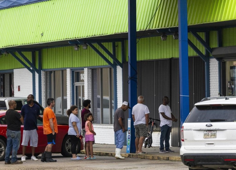 People line up for food and gas at a convenience store in Houma, La., the morning after Hurricane Francine crossed into south Louisiana on Thursday, Sept. 12, 2024. (Chris Granger /The Times-Picayune/The New Orleans Advocate via AP)