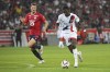 PSG's Ousmane Dembele runs with the ball watched by Lille's Thomas Meunier, left, during the French League 1 soccer match between Lille and Paris Saint-Germain, in Villeneuve-d'Ascq, France, Sunday, Sept. 1, 2024. (AP Photo/Matthieu Mirville)