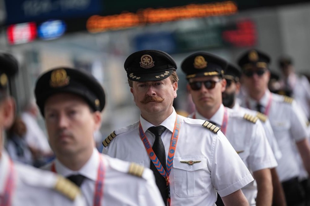 Tensions are mounting as a potential pilot strike at Canada's largest airline is only days away with no signs of a breakthrough in talks. Air Canada pilots arrive for an information picket at Vancouver International Airport in Richmond, B.C., on Tuesday, August 27, 2024. THE CANADIAN PRESS/Darryl Dyck