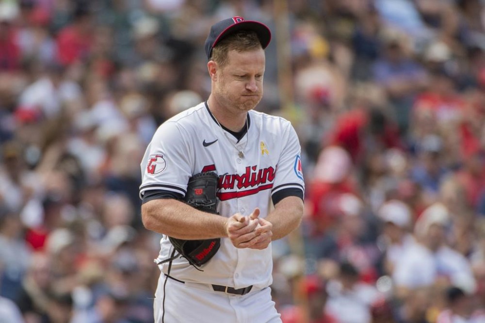 Cleveland Guardians starter Alex Cobb reacts between pitches during the seventh inning of a baseball game against the Pittsburgh Pirates in Cleveland, Sunday, Sept. 1, 2024. (AP Photo/Phil Long)