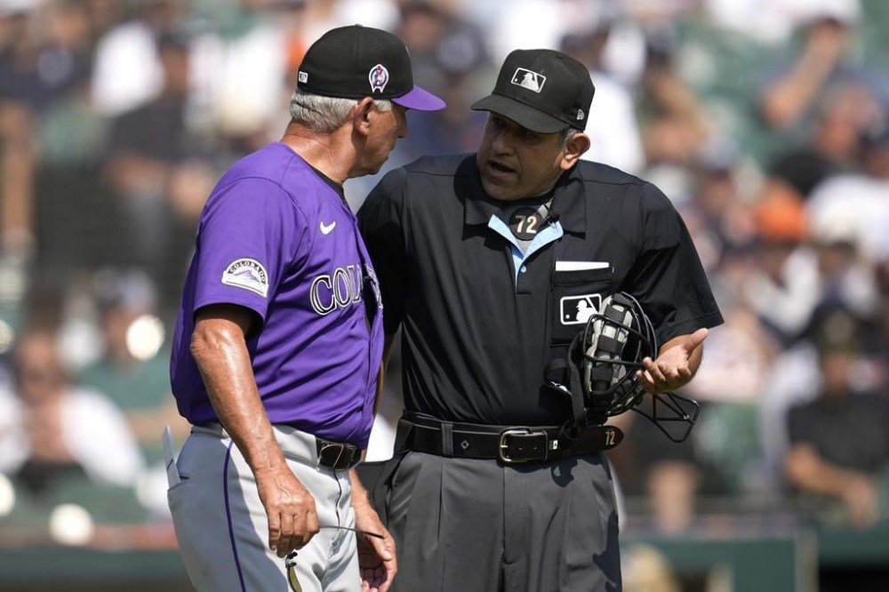 Colorado Rockies manager Bud Black, left, argues with home plate umpire Alfonso Marquez in the fourth inning of a baseball game against the Detroit Tigers, Thursday, Sept. 12, 2024, in Detroit. (AP Photo/Paul Sancya)