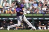 Colorado Rockies' Jacob Stallings hits a one-run double against the Detroit Tigers in the ninth inning of a baseball game, Thursday, Sept. 12, 2024, in Detroit. (AP Photo/Paul Sancya)