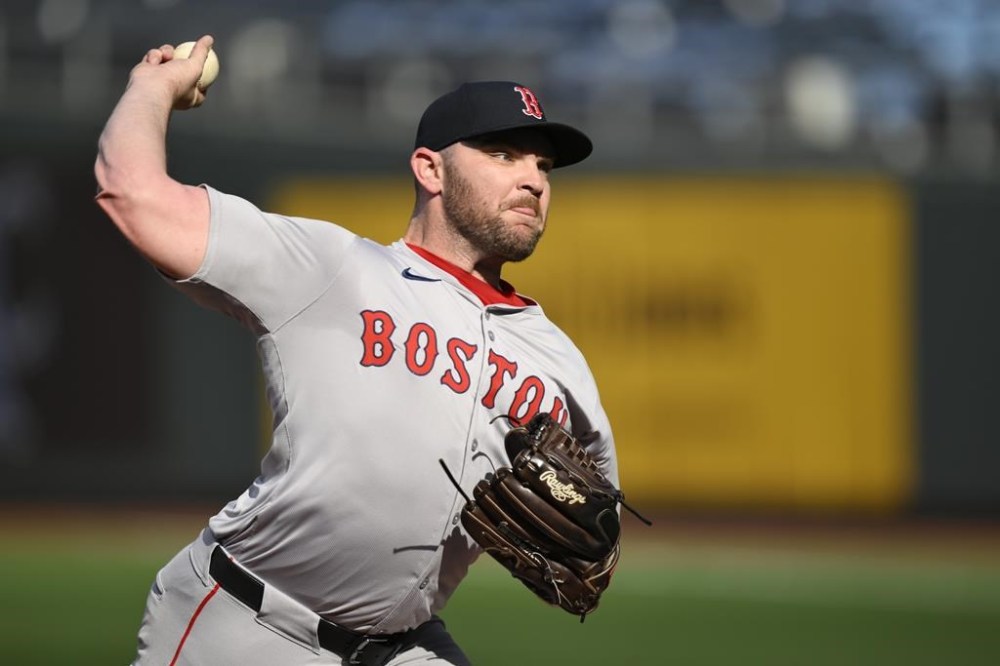 FILE - Boston Red Sox pitcher Liam Hendriks throws during warmups before a baseball game against the Kansas City Royals, Aug. 6, 2024, in Kansas City, Mo. (AP Photo/Reed Hoffmann, File)
