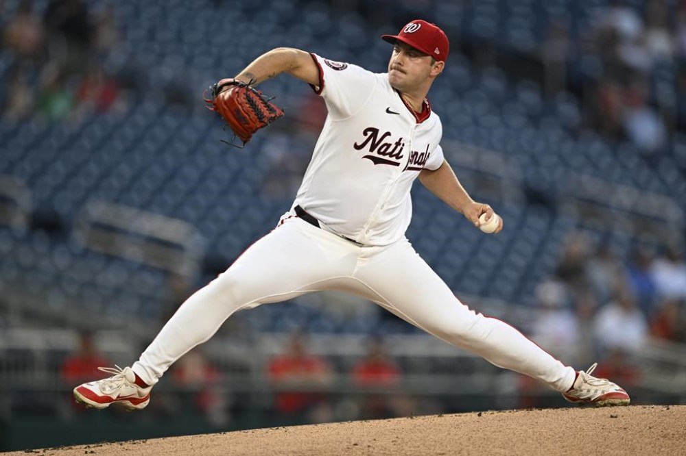 Washington Nationals starting pitcher Mitchell Parker throws through during the first inning of a baseball game against the Miami Marlins, Thursday, Sept. 12, 2024, in Washington. (AP Photo/John McDonnell)