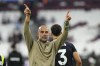 Manchester City's head coach Pep Guardiola greets supporters at the end of the English Premier League soccer match between West Ham United and Manchester City at the London Stadium in London, England, Saturday, Aug. 31, 2024. (AP Photo/Frank Augstein)