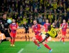 Dortmund's Serhou Guirassy, right, and Patrick Mainka of Heidenheim in action during the Bundesliga soccer match between Borussia Dortmund - 1 FC Heidenheim at Signal Iduna Park, Dortmund, Germany, Friday Sept. 13, 2024. (Bernd Thissen/dpa via AP)