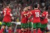 Portugal's Bruno Fernandes, centre, celebrates after scoring his side's first goal with Cristiano Ronaldo, left, Bernardo Silva, second from left, Nuno Mendes, right, and Ruben Neves during the UEFA Nations League soccer match between Portugal and Scotland at the Luz stadium in Lisbon, Portugal, Sunday, Sept. 8, 2024. (AP Photo/Armando Franca)