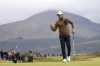 Matteo Manassero waves after putt on the sixth green during the third round of the Irish Open golf tournament at Royal County Down in Newcastle, Northern Ireland, Saturday, Sept. 14, 2024. (Peter Morrison/PA via AP)
