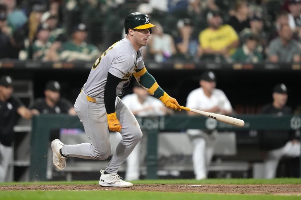 Oakland Athletics' Brent Rooker watches his two-run single off Chicago White Sox relief pitcher Chad Kuhl during the sixth inning of a baseball game Saturday, Sept. 14, 2024, in Chicago. (AP Photo/Charles Rex Arbogast)